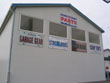 Custom license plate signs on back of shop